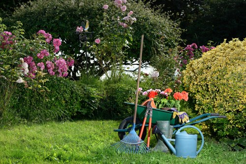 Professional gardener working on sustainable practices in Battersea garden